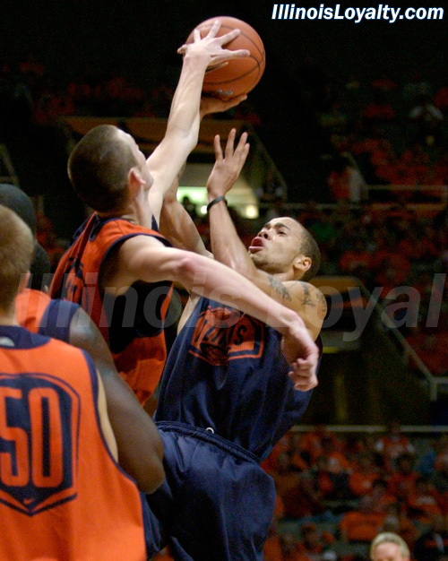 Bill Cole blocks Calvin Brock