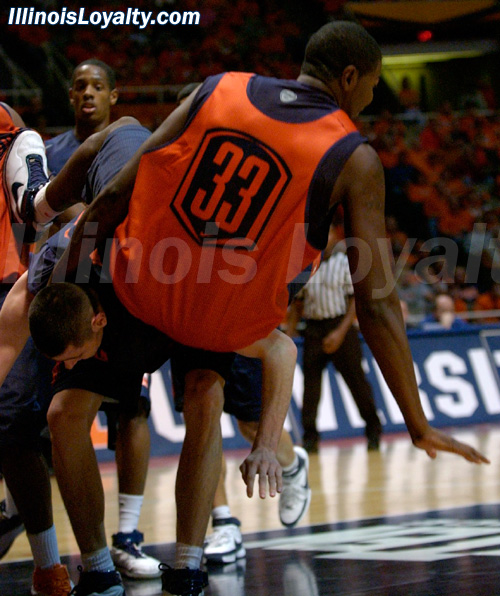 Brian Carlwell falls over Mike Tisdale