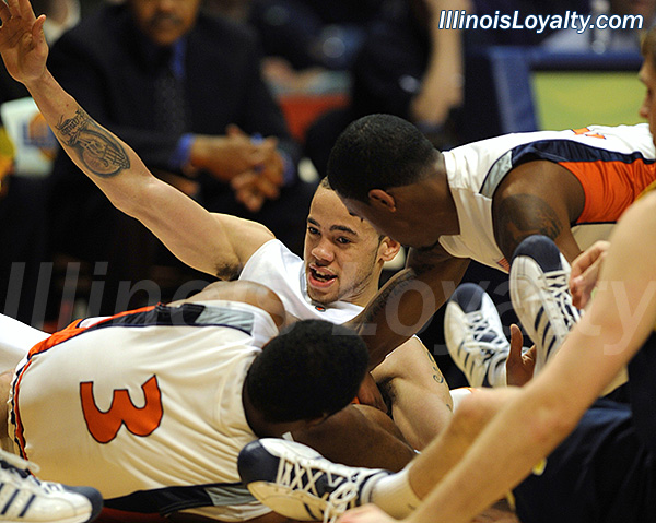 Chester Frazier, Jeff Jordan and Calvin Brock scramble for the ball